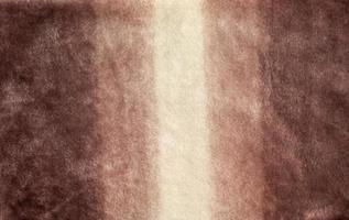 padrão de close-up de tecido de lã. tons de bege na superfície de roupas de pele, fundo de textura abstrata. foto