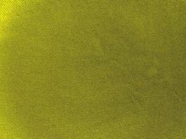 textura de tecido de algodão amarelo usada como plano de fundo. fundo de tecido amarelo vazio de material têxtil macio e liso. há espaço para o texto. foto