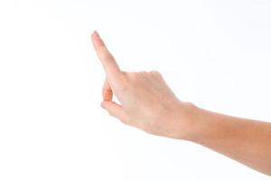 a mão feminina estendida para a frente com o dedo indicador levantado é isolada em um fundo branco foto