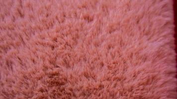 textura de lã rosa como pano de fundo foto