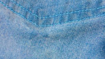 textura de jeans azul como plano de fundo foto