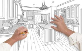 mãos masculinas esboçando uma bela cozinha personalizada foto