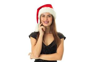 linda garota feliz com chapéu de Papai Noel foto