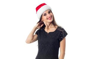 jovem garota bonita com chapéu de Papai Noel foto
