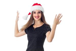 garota feliz com chapéu de Papai Noel foto
