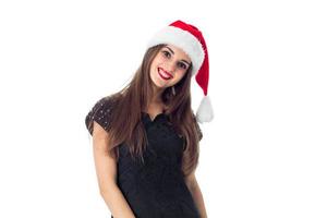 jovem encantadora com chapéu de Papai Noel foto