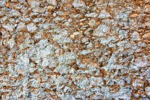 antigo fundo de parede de pedra, textura de parede de pedra. velhas pedras quebradas, close-up. foto