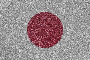 bandeira do japão retratada em muitas pequenas lantejoulas brilhantes. fundo festival colorido para festa foto