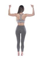 fitness feminino ou instrutor aeróbico com corpo perfeito. isolado no fundo branco foto