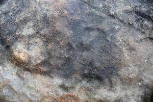 feche a vista em uma textura de granito e parede de pedra em alta resolução. foto