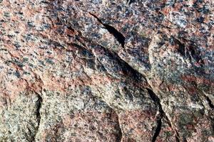 feche a vista em uma textura de granito e parede de pedra em alta resolução. foto