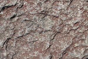 feche a vista em uma textura de granito e parede de pedra em alta resolução. foto