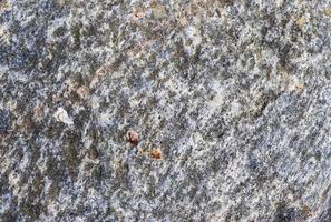 feche a vista em uma textura de granito e parede de pedra em alta resolução. foto