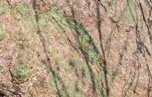 feche a vista em uma textura de granito e parede de pedra em alta resolução. foto