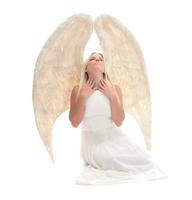 retrato de uma linda mulher loira com asas de anjo. anjo com cabelo longo encaracolado foto
