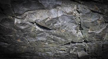 fundo de pedra preta cinza escuro ou textura. foco seletivo foto