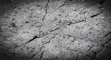 foco seletivo. fundo de pedra preta cinza escuro ou textura. foto