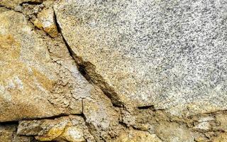 pedra áspera e padrão de textura de parede de tijolo puerto escondido méxico. foto