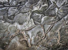 fundo de pedra preta cinza escuro ou textura. foco seletivo foto