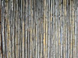 textura de cerca de prancha de bambu de tom marrom antigo para plano de fundo foto