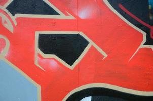 arte de rua. imagem de fundo abstrata de um fragmento de uma pintura de graffiti colorida em tons de vermelho foto
