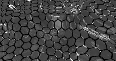 malha abstrata de ondas de hexágonos escuros metálicos com reflexões. fundo abstrato foto