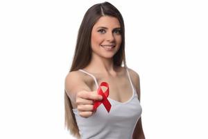 mulher segurando a fita vermelha para o dia mundial da aids de dezembro. conceito de saúde foto