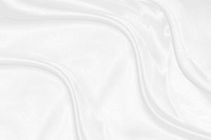 seda branca elegante suave ou textura de pano de luxo de cetim pode usar como plano de fundo do casamento. design de fundo luxuoso foto