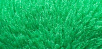 textura têxtil fofa verde. closeup de fundo peludo fralda. bandeira foto