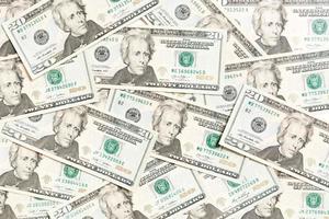 vista superior do fundo feito com notas de 20 dólares. dinheiro em usd. conceito de dinheiro americano foto