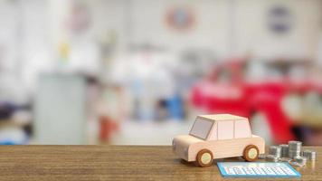 o carro de brinquedo de madeira e a calculadora azul na renderização 3d da mesa de madeira foto
