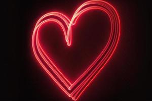 coração de luz neon vermelho com fundo preto foto