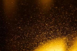 textura de glitter dourados. fundo de natal de luxo. conceito de férias. espaço de texto foto