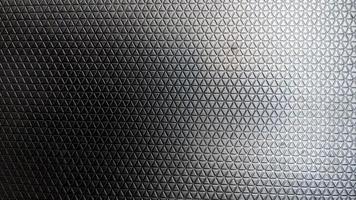 textura de triângulo de plástico preto para plano de fundo foto