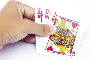 cartas de jogar em uma mão foto