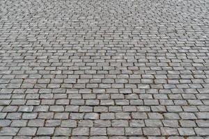 detalhe da rua de pedra pavimentada de roma foto