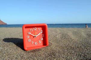 relógio na praia foto