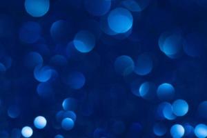 bokeh azul abstrato luz de fundo. conceito de natal e ano novo foto
