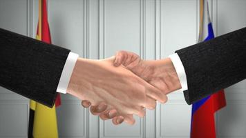 Bélgica e Rússia lidam com aperto de mão, política ilustração 3d. reunião oficial ou cooperação, reunião de negócios. empresários ou políticos apertam as mãos foto