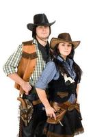 jovem cowboy e cowgirl foto