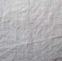 fragmento de tecido de linho cinza, textura amassada foto