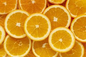fundo de fruta laranja frescor fatiado. padrão redondo. foto