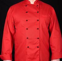 fragmento de um uniforme vermelho com botões pretos no chef foto