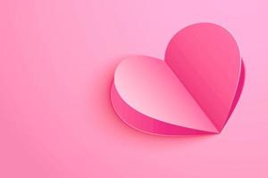 coração de papel em fundo rosa para cartão de dia dos namorados foto