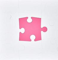 grandes quebra-cabeças em branco em um fundo rosa, vista superior foto