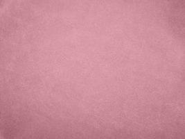 textura de tecido de veludo de cor ouro rosa usada como plano de fundo. fundo de tecido ouro rosa vazio de material têxtil macio e liso. há espaço para o texto. foto