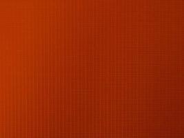 textura de tecido de veludo laranja usada como plano de fundo. fundo de pano laranja de cor de tom de material têxtil macio e suave. há espaço para texto e para todos os tipos de trabalho de design. foto