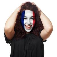 menina com pintura facial de bandeira francesa foto