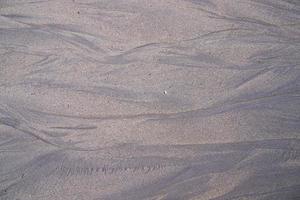 a textura de padrão de areia criada pela natureza pode ser usada como papel de parede de fundo foto