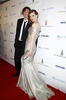 los angeles, 16 de janeiro - paul ws anderson, milla jovovich chega à festa de premiação globo de ouro 2011 da empresa weinstein e da relatividade mídia no hotel beverly hilton em 16 de janeiro de 2011 em beverly hills, ca foto